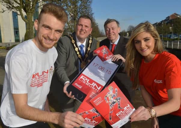 At the launch of the 2015 Coca-Cola Run Lisburn Half Marathon, 10K Road Race and Fun Run are: (l-r) Ryan McDermott, Irish Cross Country Champion; the Mayor of Lisburn, Councillor Andrew Ewing; Alderman Paul Porter, Chairman of the Council's Leisure Services Committee and Sarah Smith, Coca Cola. The event takes place on the 17th June 2015.