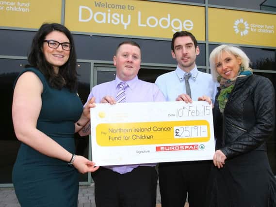 (Left to right) Sorcha Chipperfield, Cancer Fund for Children, Colin Cunningham and Keith Wilson, both EUROSPAR Crumlin and Melody Beattie, EUROSPAR Carrick Milestone, celebrate staff helping to raise £25k for the charity. INCT 09-704-CON