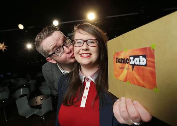 FameLab Northern Ireland winner Emer Maguire celebrates her win with compere and mentalist David Meade at the Black Box Belfast.