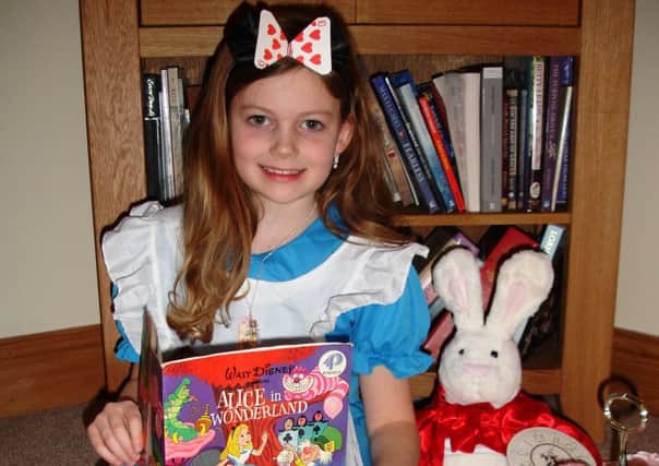 Arianne Bell from Banbridge dresses up as Alice in Wonderland to mark World Book Day.