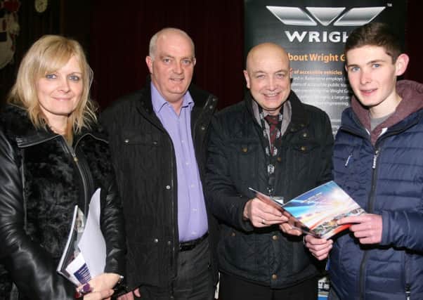 David Purdy from Wrightbus give advice to Jamie Killough along with his parent Doroty and Andy Killough, at the recent Ballymena Academy careers fair. INBT10-243AC