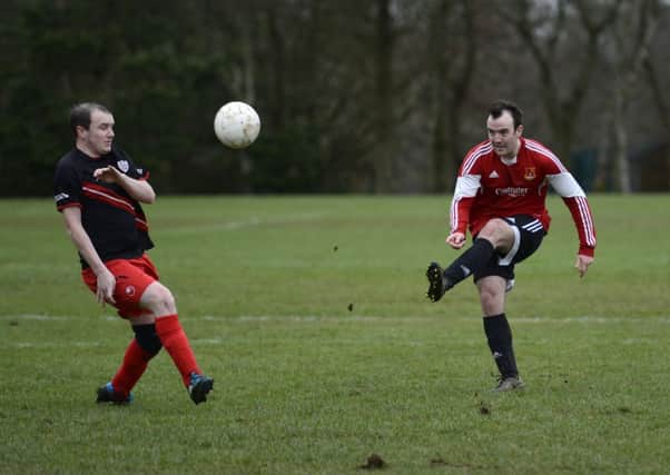 James McCracken sets up an attacking move for Foyle Wanderers during Saturdayâ¬"s match against Irish Street. INLS1015-103KM