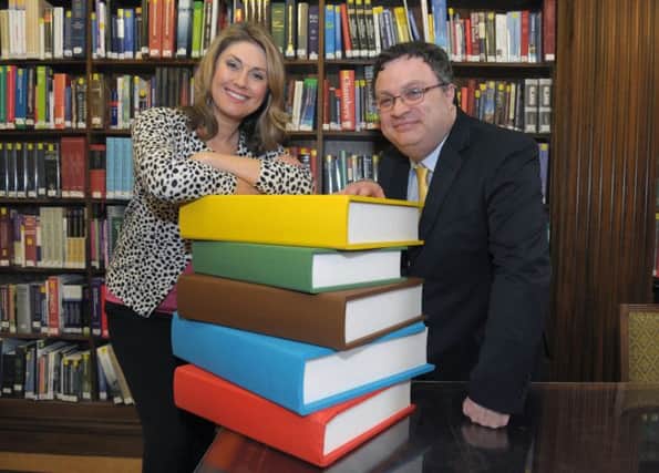 Employment and Learning Minister Dr Stephen Farry along with TV presenter Sarah Travers is urging potential learners to book an Essential Skills course and transform their lives through learning ahead of World Book day.