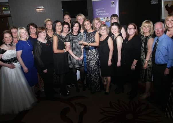 Deborah McGlinchey celebrates her win with family, friends, the judges and Derry's Mayor Brenda Stevenson.