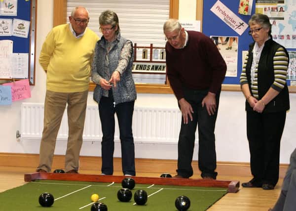 First Ballymena and Roundtower bowlers keep an eye on the bowls during their recent match. INBT11-208AC