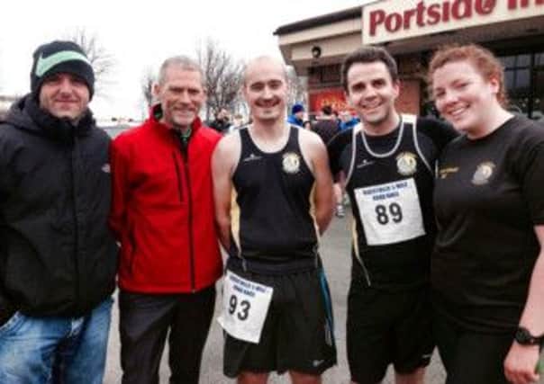 Pictured at the Albertville 5 MIle Race (l-r) are Justin Maxwell (chairman of East Coast AC), Gary Keenan (President of Athletics NI), Brian Maltman, Chris Davis and Ruth Kelly. INLT 11-919-CON