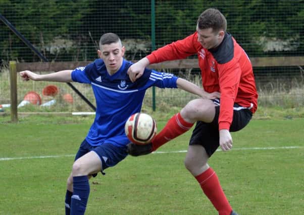 Greenisland FC and Grange Rangers in action at Foundry Lane.