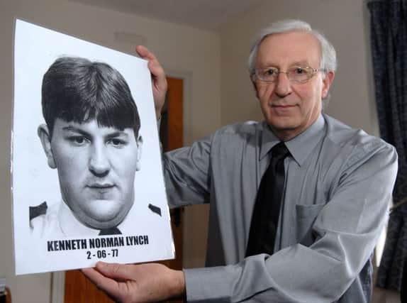 Dr Hazlett Lynch with a picture of his brother Kenneth Norman Lynch who was murdered by the IRA. Picture : Simon Robinson