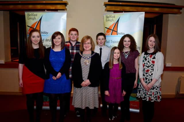 The Deputy Mayor of Carrickfergus, Councillor Lynn McClurg, with young volunteers Anna and Ruth Connelly, Naomi Stevenson and Holly and Rebecca McKinney at the Belfast Lough Sailability prize-giving dinner. INCT 10-058-GR
