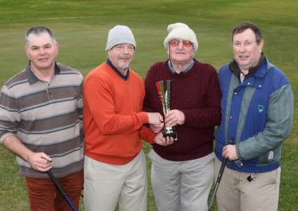 Billy Donaldson, second from left, winner of the newly-formed Lagan Valley Golf Society's first competition at Down Royal Golf Club, receives his trophy from chairman Bill Morrow. Looking on are founder member Derek McConville and society president Chris Davis. US1510-509cd  Picture: Cliff Donaldson