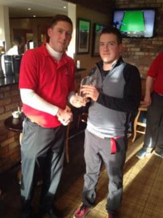 Lost Boys Golf Society captain Garreth Sloan presents the Round One top prize to winner Andrew Parr.