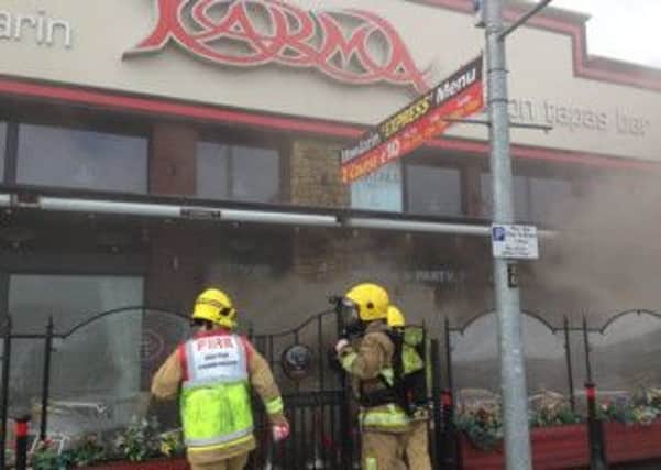 Firefighters attending a fire at the Mandarin Palace restaurant in Derry.