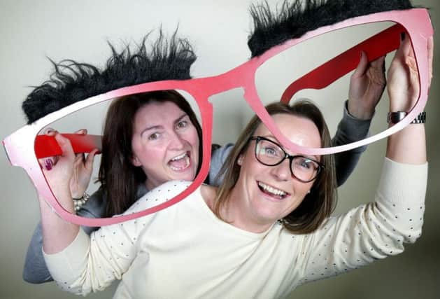 Jill Campbell (left) and Natalie Latham, Store Directors at Specsavers in Bow Street, Lisburn, make their faces funny for money.