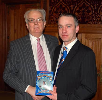 ACCEPT. Lord Laird of Artigarvan accepts a copy of a history on the Blue Lodge from WM Bro Jordan Coulter.INBM11-15 903F.