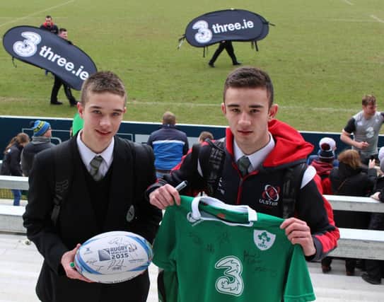 St Patrick's Pupils Nathan and Ryan Fitzsimmons with the gear they got signed.