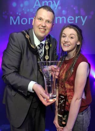Mayor Andrew Ewing presents the trophy to Wallace High School student Amy Montgomery after she won the 'Lisburn's Got Talent' show at the civic centre. US1508-546cd  Picture: Cliff Donaldson