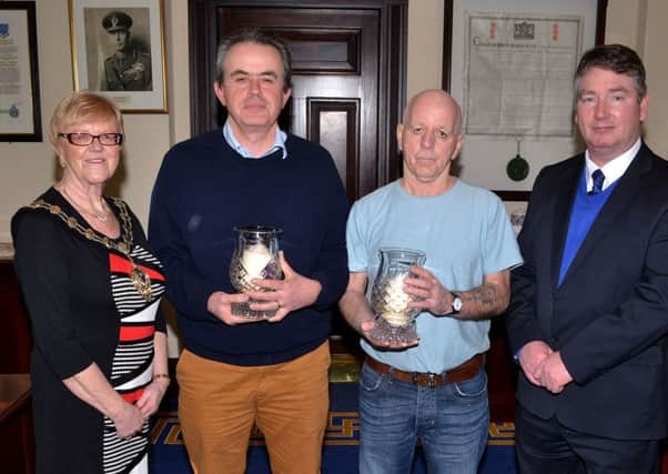 Aidan Toner who has been Health & Safety Officer for the past 21 years and Patrick Dunne who has been a Refuse Collector for 37 years received special presentations at a Mayor's reception to mark their retirement at the Braid Town Hall. Aidan was presented with his award by Acting Town Clerk and Chief Executive Rodger McKnight while Patrick received his award from Mayor Audrey Wales. INBT 11-100JC