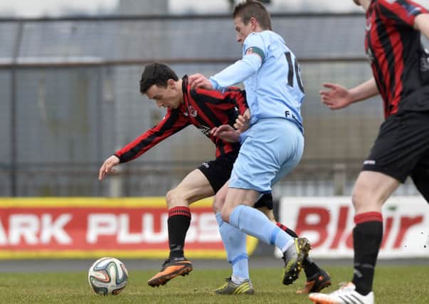 Ballymena United's Allan Jenkins surived a penalty appeal for this challenge on Crusaders Paul Heatley during today's match at the Showgrounds. Picture: Press Eye.