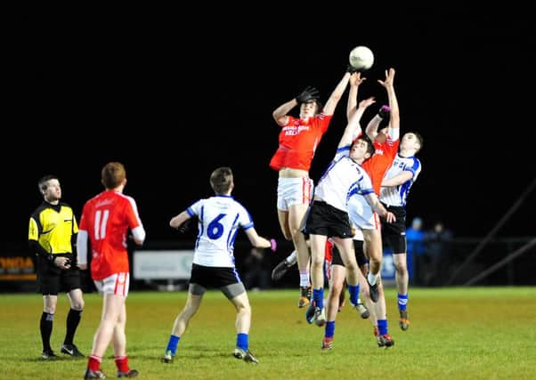 St Patrick's Academy Dungannon and St Patrick's College Maghera battle for the ball during Wednesday night's MacRory Cup quarter final clash at Ballinderry.INTT0815-305