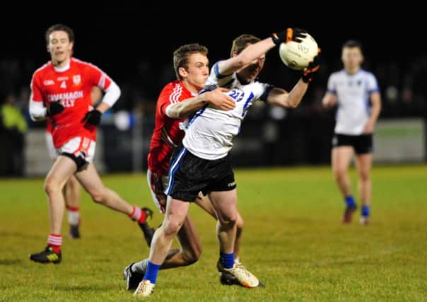 St Patrick's Academys Brian Kennedy tackles St Patrick's College Maghera's Jack Doherty.INTT0815-310