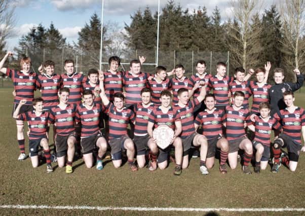 Ballymena Academy's Medallion XV celebrates their Medallion Bowl victory over Down High School at Roughfort.