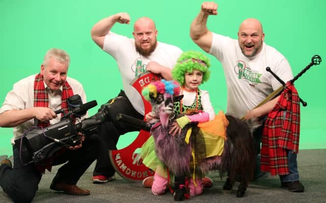 Adrian Morrow, Festival Director, with Strongmen Chris Mac Naughton, Dave Warner and Megan Ross 8, with her fashion winning goat called Billy,from Cullybackey.  Picture Paul Faith