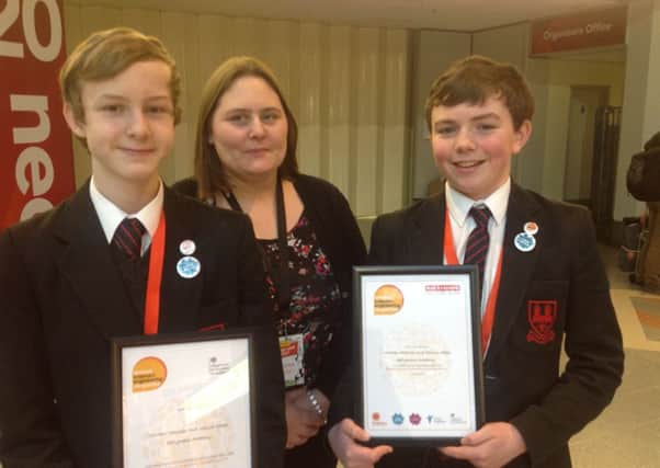 Callum and Matthew receiving their Highly Commended award in the junior category of the Engineering and Technology competition at the Big Bang Fair.