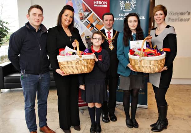 The Primary and Secondary School winners of the Fairtrade Bake-Off at Cloonavin sponsored by Heron Bros in association with Coleraine Council. From left; Heron Bros Danny Gorman and Caroline Hughes, Alice Anderson of Ballytober PS,  Councillor George Duddy, Mayor of Coleraine, Abigail McAfee of the North Coast Integrated College, and Fiona Watters, CBC Recycling Officer. INCR10-343PL