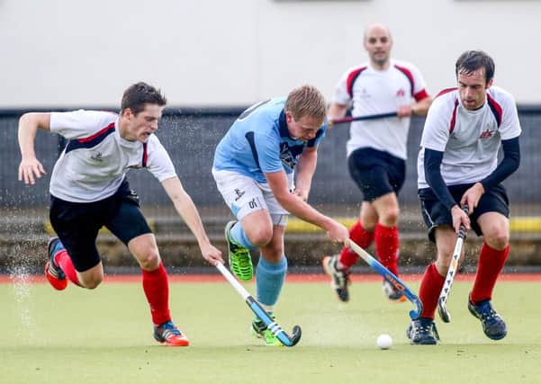 © Press Eye Ltd Northern Ireland- 4th October 2014
Irish Senior Hockey Cup, Lisnagarvey v Annadale at Lisnagarvey Hockey Club, Comber

Pictured is Lisnagarvey's Jason Lynch and Annadale's Michael Robson in action during todays game

Picture - Kevin Scott / Presseye