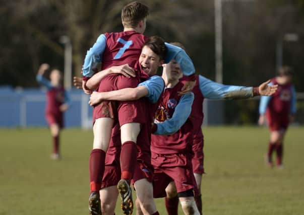 Newbuildings United III striker Dylan McCorkell is mobbed by his team-mates after he had scored against Ardmore Reserves. INLS1115-138KM
