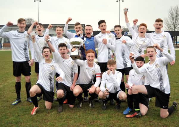 Glengormley school Edmund Rice College celebrate their first-ever Schools' Senior Cup final success after their 2-1 win over Grosvenor Grammar at New Grosvenor on St Patrick's Day. Photo: Tony Hendron / Presseye