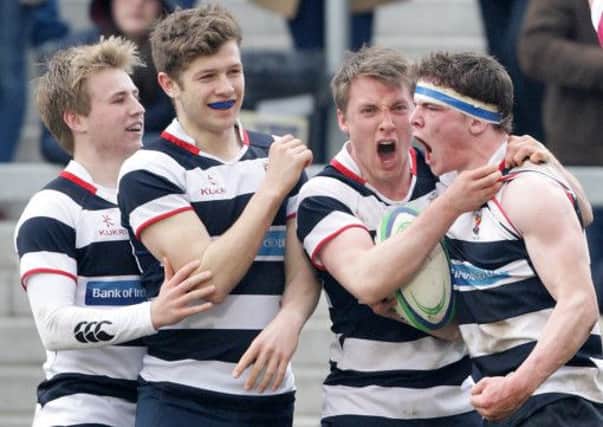 Wallace High School players celebrate after Max Trouton scored a try against RABI during the School's Cup final at Ravenhill. US1511-581cd  Picture: Cliff Donaldson