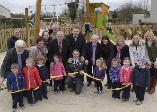 Banbridge District Council Vice Chairman Cllr Councillor Pól O'Gribin cut the ribbon to officially open the new Play Park at Riverside in Leitrim, included with parents and children are DRAP Vice Chair David Kerr, Director of Leisure & Development Catriona Reagan, Vice Chair Leisure & Development Cllr Seamus Doyle, Chris Hazzard MLA, Vince McKevitt DARD, Rural Project Development Officer Pamela Dempster and DARD Project Officer Lisa Clydesdale  ©Edward Byrne Photography INBL1512-218EB