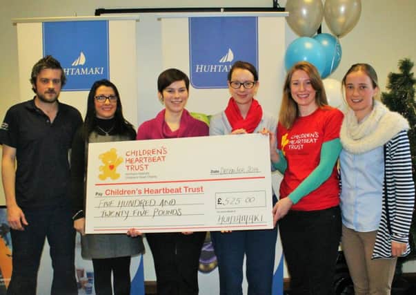 Huhtamaki Lurgan, global specialists in packaging for food and drink, has presented two local Northern Irish charities with a cheque for more than £500 each, with a promise to continue raising funds for the causes throughout 2015. The Childrens Heartbeat Trust and Newry and Mourne Public Initiative for the Prevention of Suicide and Self Harm (P.I.P.S) received the majority vote from over 200 employees to be Huhtamakis joint Charity Partners of the Year. Over the course of the last twelve months, the Lurgan-based workforce engaged in various fundraising activities, organised by the firms designated Charity Committee, to raise more than £1000 for the charities. Pictured (L-R) are Huhtamaki employees Will Greenaway, Joan Esmann, Catherine Isted, Sarah Stewart, Sarah Quinlan (Childrens Heartbeat Trust) and Melissa Lawson.