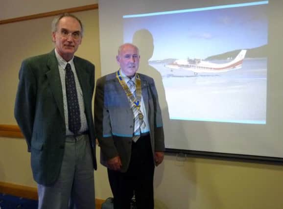 Guy Warner, aviation historian, with Sam Crowe, president of Carrickfergus Rotary Club. INCT 12-702-CON