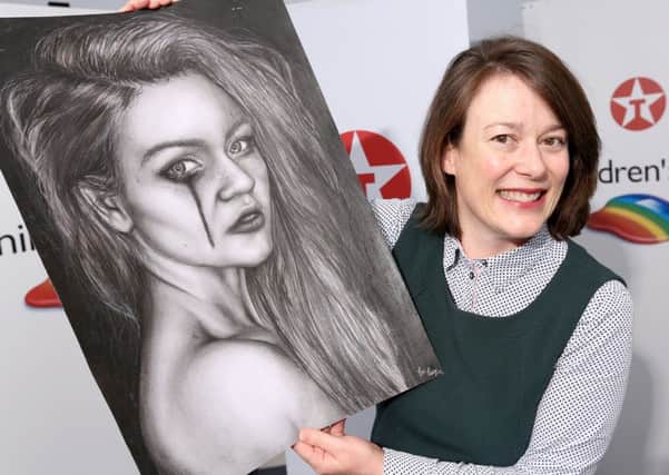 Pictured admiring one of the entries received from Antrim is Bronagh Carron, Marketing Manager Valero Ireland. The work, entitled Imperfection, was submitted by 17-years old Erin Casey, a pupil at St. Louis Grammer School, Ballymena.