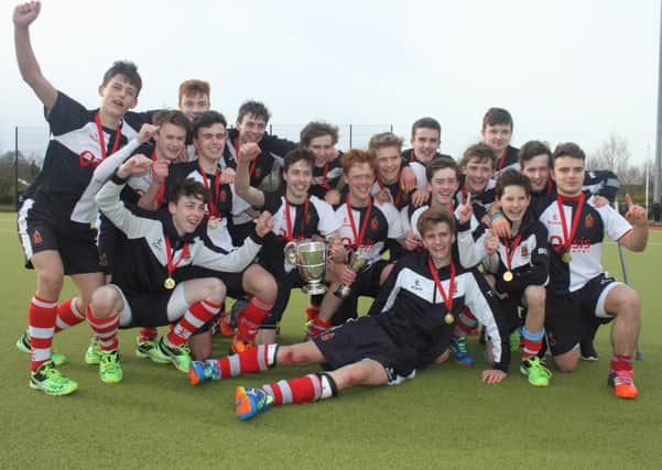Wallace High School celebrate winning the Burney Cup for the second year in a row. The Lisburn school side edged Banbridge Academy with a 3-2 win at Comber Road on Wednesday afternoon. Pic by Sam Smyth