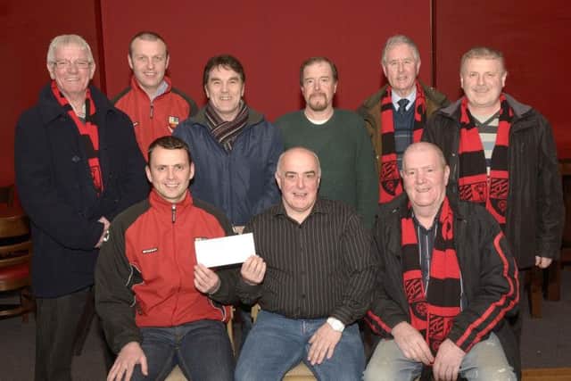 On behalf of Banbridge Town Supporters Club Vice Chairman / Treasurer Terry Sweeney presented a cheque for £500:00 to Town Juniors U11 Manager Johnny Kerr towards the teams expenses to take part in the Easter  Cup Tournament in Preston, included is Dan Buchanan ( Transport Officer), Paul Chambers, Lee McGrath, Paul Stewart, Ned Campbell, Michael Duffy and Raymond Cannaway Edward Byrne Photography INBL1512-271EB