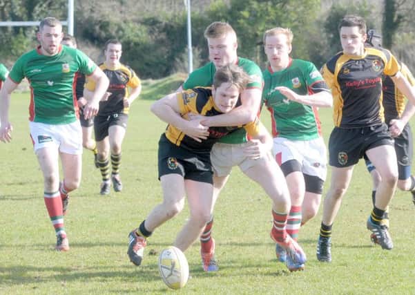 Larne's Jordan Burns thwarts this Letterkenny attack. INLT 12-203-AM