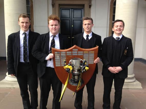 Local lads Ethan Harbinson, Jake Chambers, TJ Morris and Michael Lowry show off the Schools' Cup trophy.