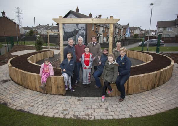 Daryl Gilmore, Ruby Wilson, Courtney Gilmore and Darcey Smith at the opening of the new growing space in Castlemara with community representatives Susanne Campbell and Lyndsay Graham, the Housing Executives Ronnie McCreanor, Colin Baker and Chris Davis and landscape architect, Barry Craig.  INCT 12-725-CON