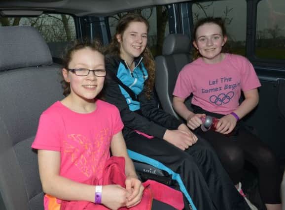 Jennifer on board the people carrier which made it's way from Eglinton to Fanad on St Patrick's Day, with two young supporters.