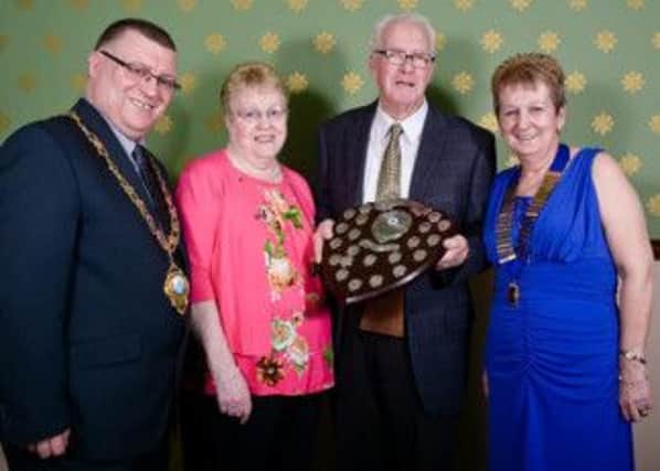 Antrim Coast Lions President Karen McAuley, Larne Mayor Martin Wilson and the recipient of the Bob Shannon Memorial Trophy, John Gibbons and his wife Annie. INLT 12-680-CON