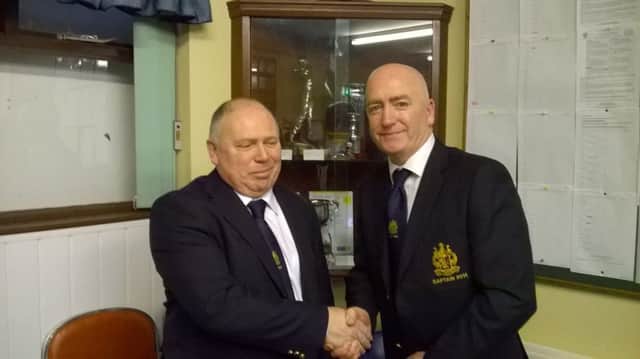 New Captain, Stephen Boyd presents outgoing Captain John Greeran with a plague to commemorate his year in the role.