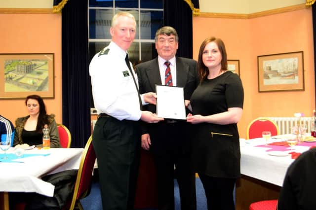 Chief Inspector Stephen Reid and Councillor Noel Williams with Gail McLaughlin from Woman's Aid. INCT 12-040-GR