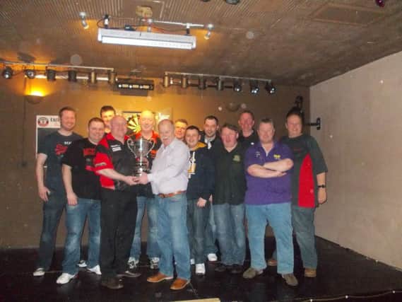 G Alexander presents P White of Byrnes with McKee Cup in the Alexanders Lisburn and District Dart League.
