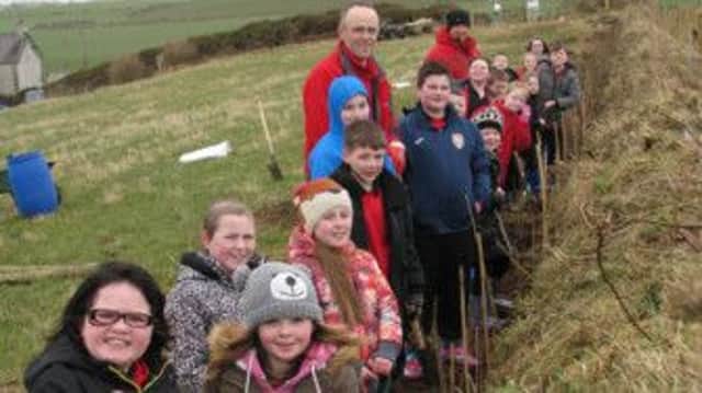 Bushmills Primary pupils pictured with Dr Cliff Henry. INBM 14-15 HEDGE