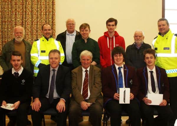 Organisers, participants and prizewinners at the third annual Shannan McCracken Road Safety event organised by Ballymoney Road Safety committee at St. James's Church hall last Wednesday. Included are Mr Sam Knox, Ballymoney Road Safety Committee, Mr Tom Skelton, principal of Dalriada School whose students supported the event, Sydney Henry and Stuart Crutchley,PSNI Roads Education officers, and representatives from the Institute of Advanced Motorists. INBM 14-15 Road Safety 1