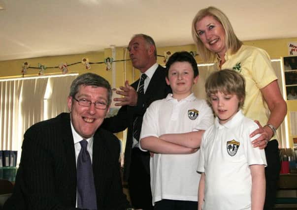 The NI Minister of Education John O'Dowd meets Rossmar school pupils Paddy and Brandon following their presntation to him. Also included are principal Mr Brian McLaughlin and teacher Nuala McNeill. INLV1222-341KDR