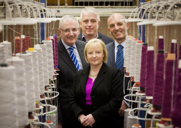 Translink has appointed Magherafelt based company Floors for Living (NI) Ltd as the carpet supplier for the cross-border Enterprise train service which is currently undergoing a £12.2million refurbishment. In this £90,000 contract, Floors for Living (NI) will supply two types of carpets; saloon carpet being manufactured by Ulster Carpets in Portadown and vestibule carpet manufactured by Forbo flooring based in Derbyshire. The chosen specialist carpets meet the robust and durable requirements of a busy railway environment while offering a modern and attractive design and colour scheme. Pictured during a factory tour of Ulster Carpets in Portadown are Transport Minister Danny Kennedy MLA, Bernard Hughes, Managing Director Of Floors for Living Ltd, Ian Campbell, Translink Head of Rail Operations and (front) Elaine Patterson, Ulster Carpets Contract Sales Director.  Picture by Brian Morrison.